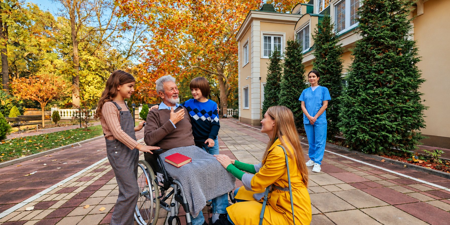 Une famille rend visite à un senior en fauteuil roulant dans un parc en automne.